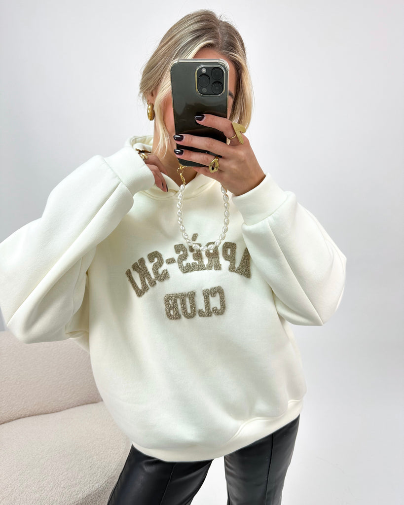 Creme/witte hoodie/trui met bruine teddy tekst erop: Apres-Ski Club