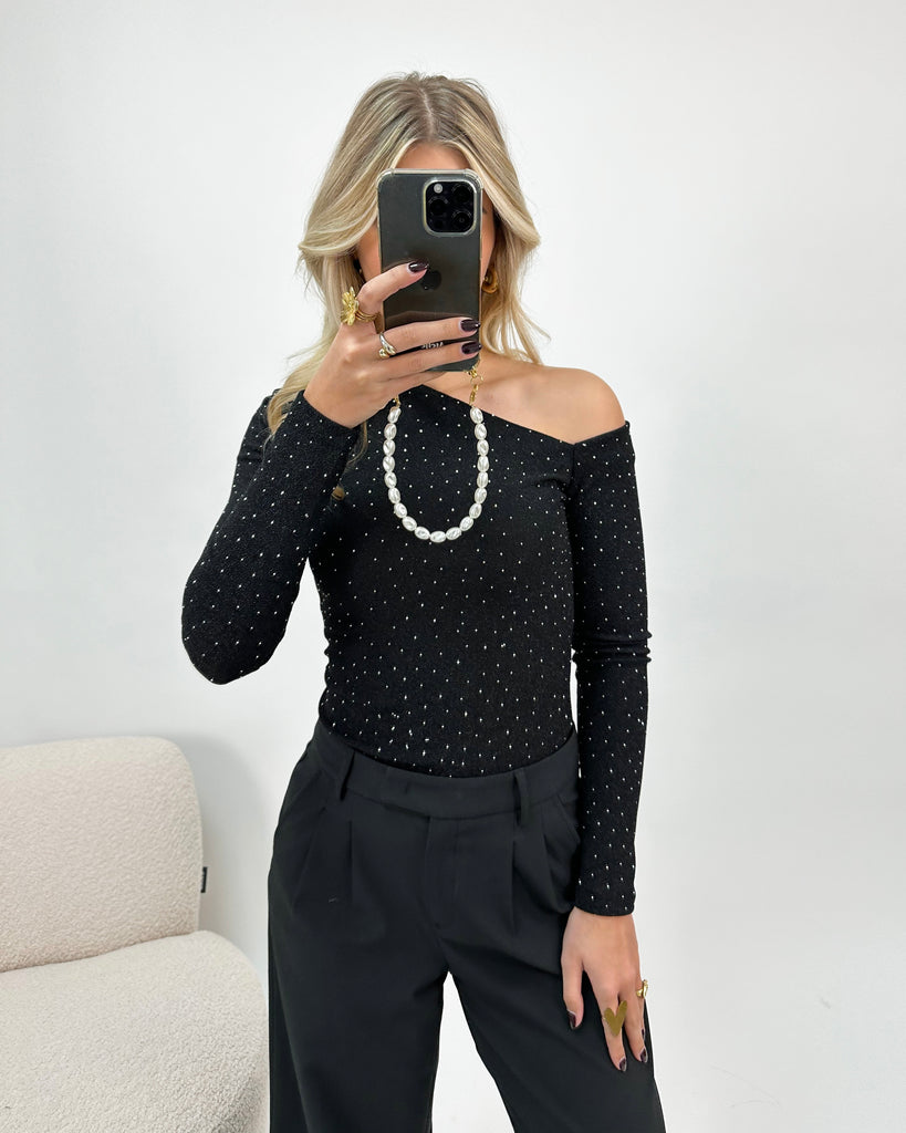 Zwarte one shoulder top met zilveren glitters